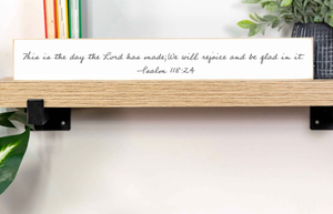 “This is the day the Lord has made” shelf sitter.  Measures 2 1/2” x 18”